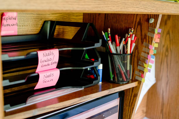 Homeschooling Classroom inbox for homeschool papers, writing, pens, pencils, tabs, brown desk, folders, files, organization inbox filing tray stock pictures, royalty-free photos & images