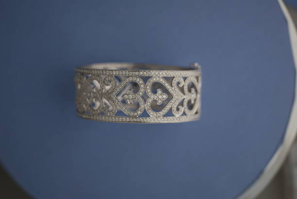 White gold bangle bracelet studded with diamonds. Openable bangle. Wide bangle bracelet