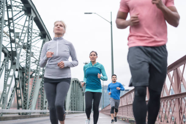 istock A group of co-ed runners goes for a training run in the city 998819600