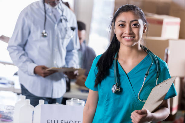 istock Confident nurse volunteering in free clinic 998833394