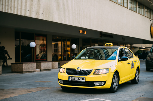 Prague, Czech Republic - September 22, 2017: Yellow Skoda Octavia III Taxi Car Parked On Street.