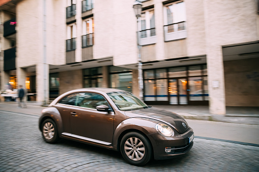 Vilnius, Lithuania - September 29, 2017: Side View Of Brown Volkswagen New Beetle Hatchback Coupe Car In Motion On Street.