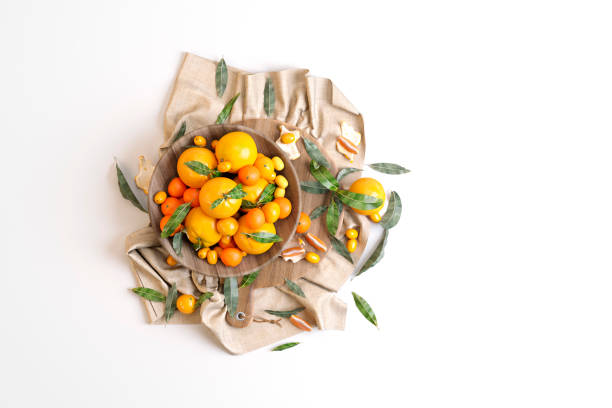 istock still life plate with oranges on white background 998852804