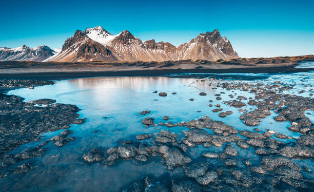 istock Scenic View Of Mountains And Lake 998856622