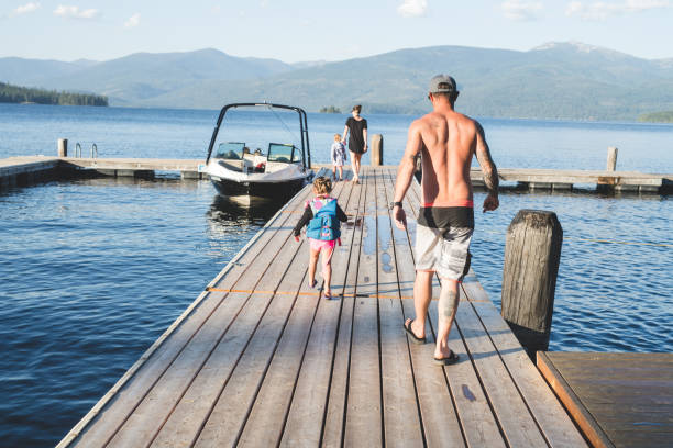 istock A dad and his young daughter walk down a dock to their boat 998858880