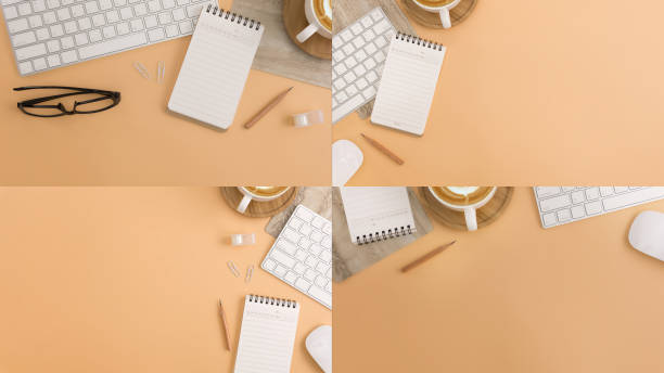 istock Flat lay, top view office table desk. Workspace with blank note book, keyboard, office supplies and coffee cup on light brown background. 998858942