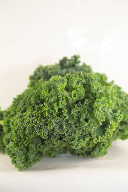 istock Kale on white shot portrait 998865362