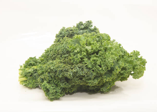 istock Crisp fresh kale on white, all focus 998865398
