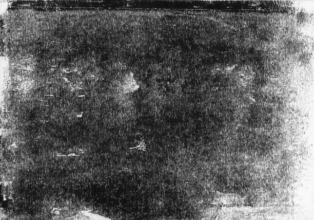 istock A lino printed, distressed, grunge texture background in black and white. 998869182