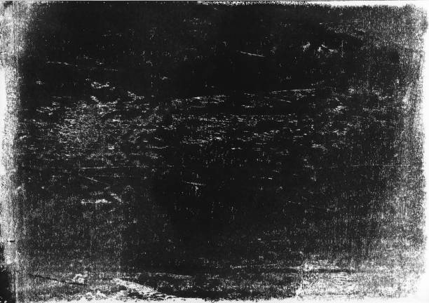istock A lino printed, distressed, grunge texture background in black and white. 998869272