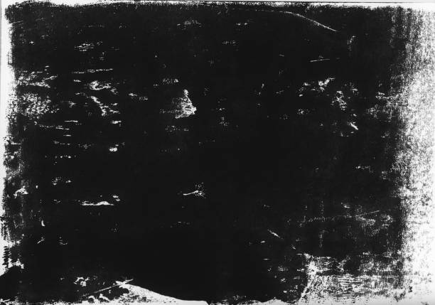 istock A lino printed, distressed, grunge texture background in black and white. 998869354