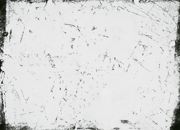 istock A lino printed, distressed, grunge texture background in black and white. 998869546