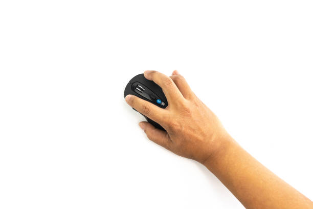 istock Hand of man is using the bluetooth mouse isolated on white background 998869574