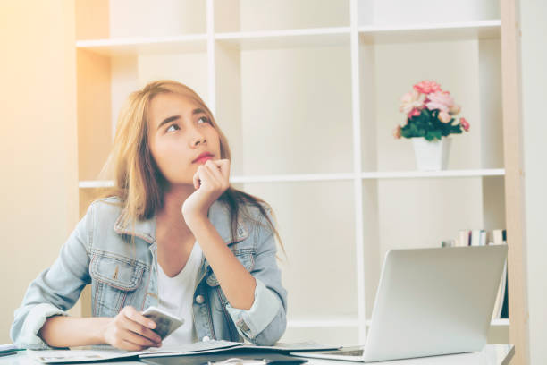 istock Creative woman thinking or planning in the office. 998885348