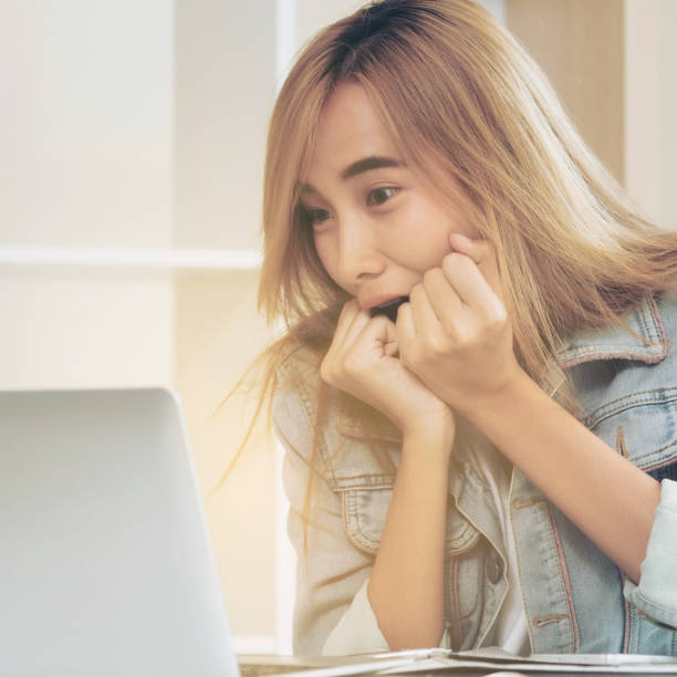 istock Cute woman feels excited while looking at computer 998885354