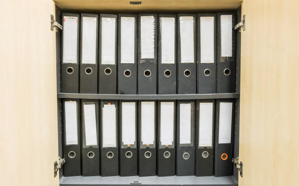 istock Closeup group of document file in file cabinet background 998885632