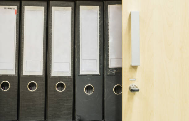 istock Closeup group of document file in file cabinet background 998886112