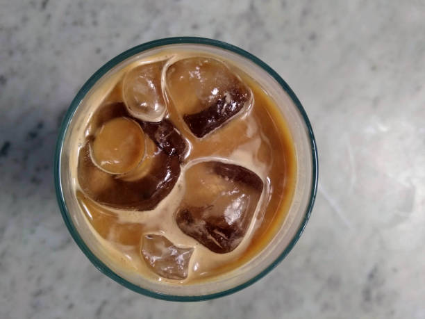 A cup of ice cafe latte served cold at a cafe.