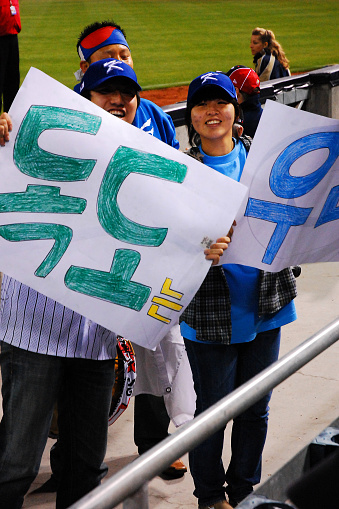 San Diego, CA, USA March 19, 2009 A young man and woman show their support for the Korean baseball team at an international match in San Diego, California