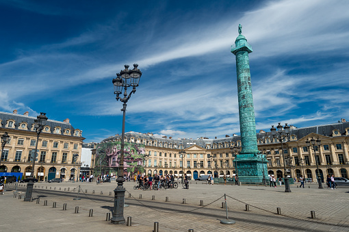 Paris, France - 23 June 2018: Wide angle view of Place Vendome square with blue sky.