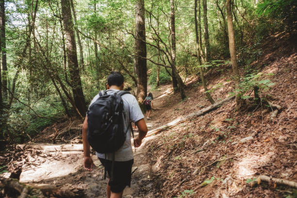 istock teenagers hiking on a trail 998908920