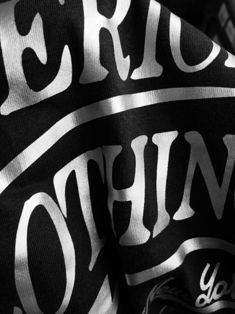 istock Black shirt design with silver sticker. Printing on textile or clothing. 998912128