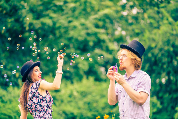 istock Couple blowing bubbles outdoor 998916566