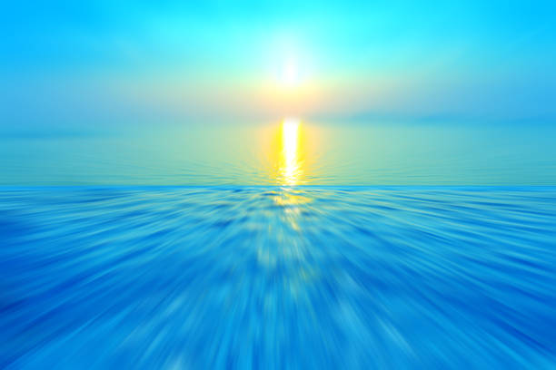 Motion blurred background of refraction in water. Panoramic dramatic view of Infinity sunset on the sea at twilight times.