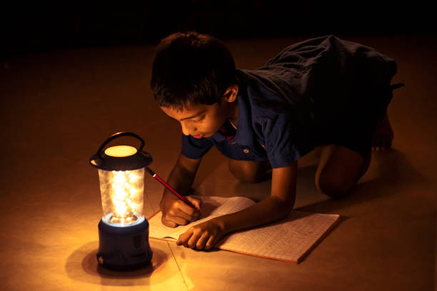 istock 7 years Indian Boy studying under lamp 998926086
