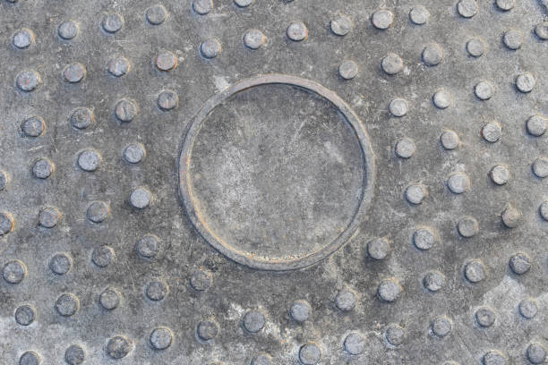 istock surface old steel of drain cap background. 998926394