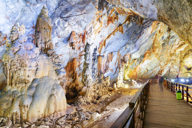 istock Wooden walkway through natural corridor among stalagmites 998940664