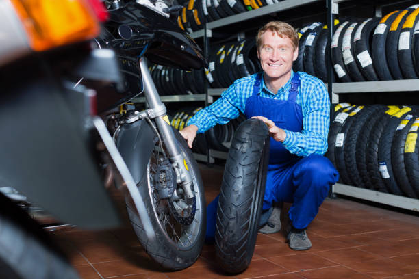 istock Man working with bike tires 998953566