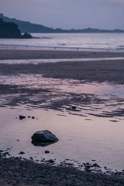 istock Small boulder in a pool of water 998957720