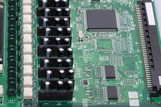istock Electronic components are mounted on the device board Chips diodes capacitors chokes Close-up 998960506