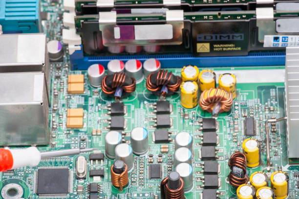 istock Electronic elements installed on the board Concept of repairing laptop computers Close-up 998960586