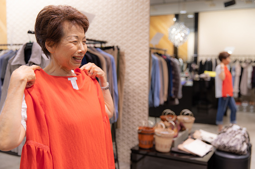Senior Japanese woman shopping clothes