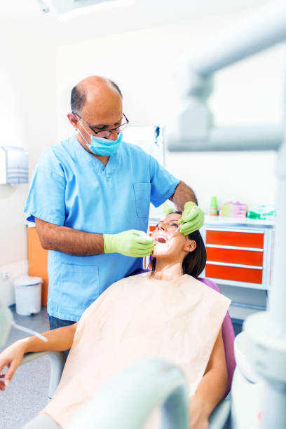 istock Dentists with a patient during a dental intervention 998972554