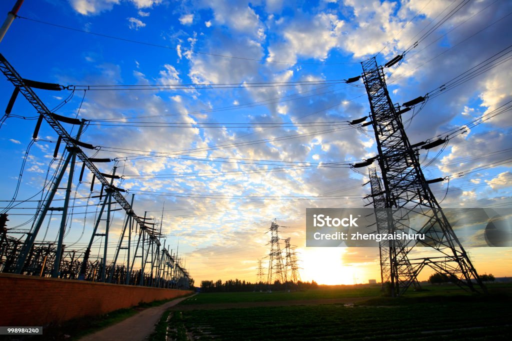 Substation in the evening, the silhouette of the power supply facilities Authority Stock Photo
