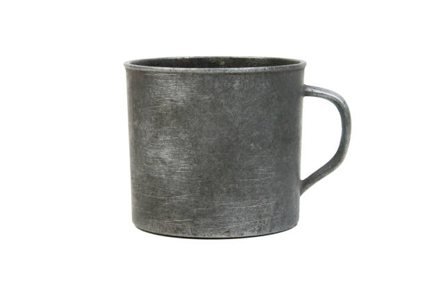 istock Vintage aluminium mug with handle on white 998993760
