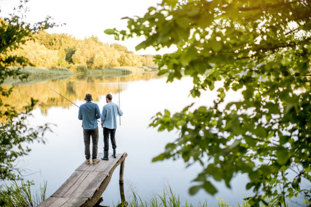 istock Men fishing on the lake 998996578