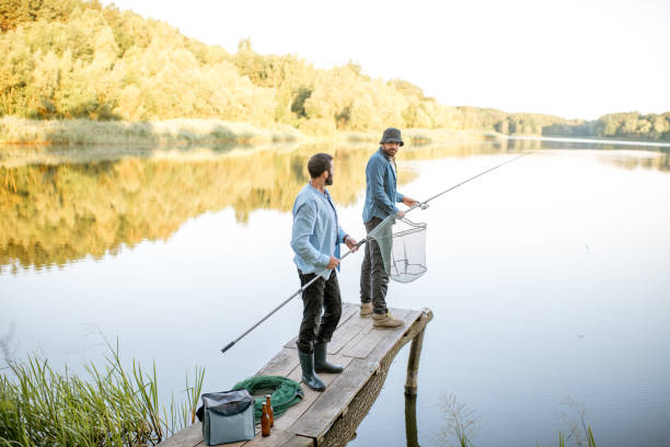 istock Men fishing on the lake 998996714