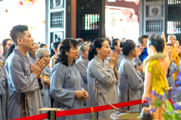 Ho Chi Minh City, Vietnam - May 29, 2018: Buddhist praying Buddha in Buddha's birthday celebrations being held in pagoda morning as a ritual of traditional culture in Ho Chi Minh city, Vietnam