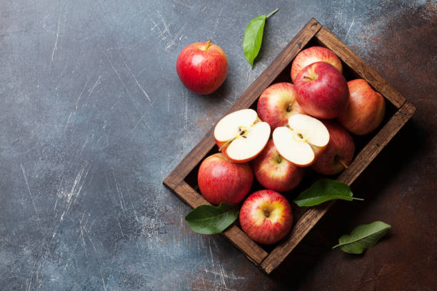 istock Red apples in wooden box 998996908