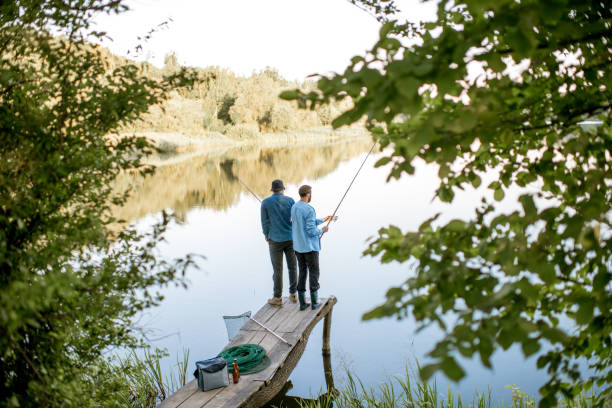 istock Men fishing on the lake 998997006