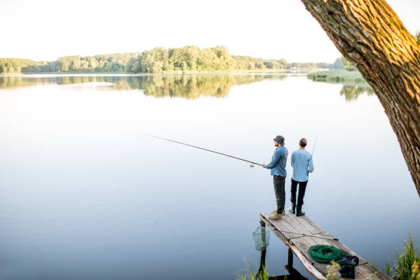 istock Men fishing on the lake 998997106