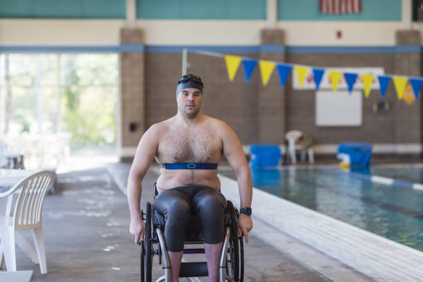 istock Adaptive athlete prepares to swim in a pool 998997196