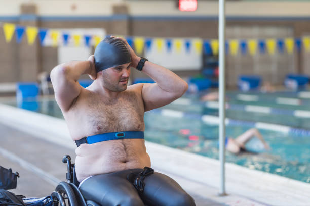 istock Adaptive athlete prepares to swim in a pool 998997202