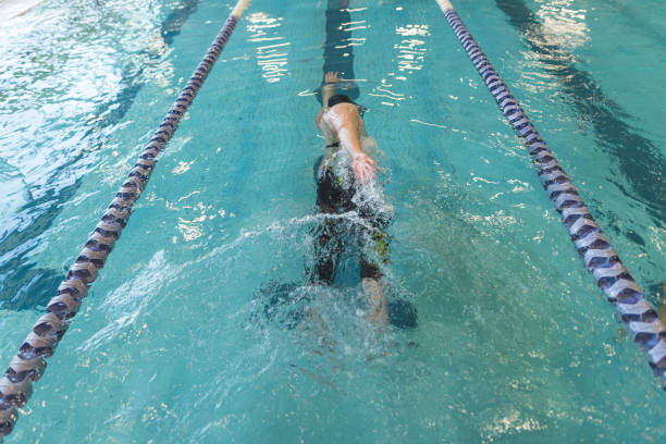 istock Adaptive athlete swims laps in a pool 998997344