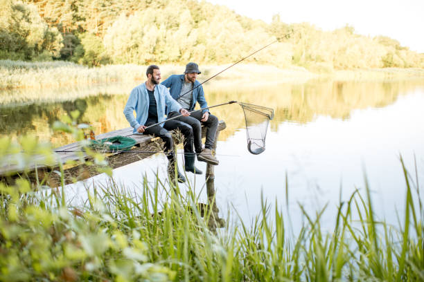 istock Men catching fish on the lake 999000364