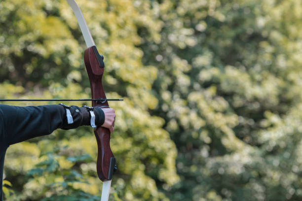 istock Training exercises for shooting archery on an outdoor target. 999005592